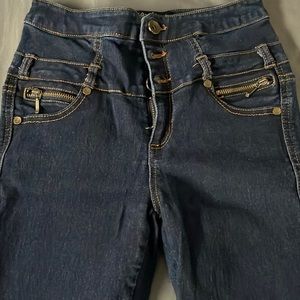 very dark blue jeans. size 1 in women’s.
